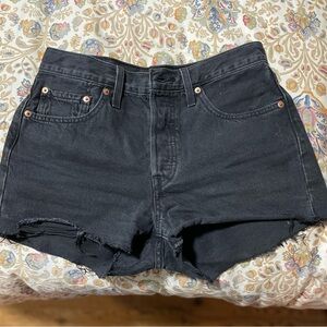 Black Levi’s 501 denim shorts with distressed hem